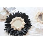 miroir rond avec plume